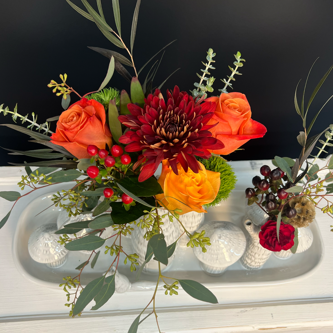 topview of autumn grove budvase with flowers