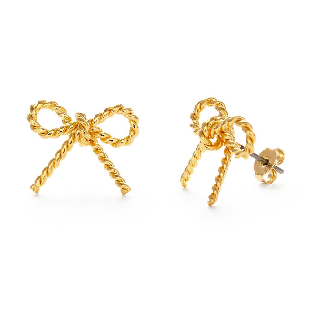 gold bow earrings on white background
