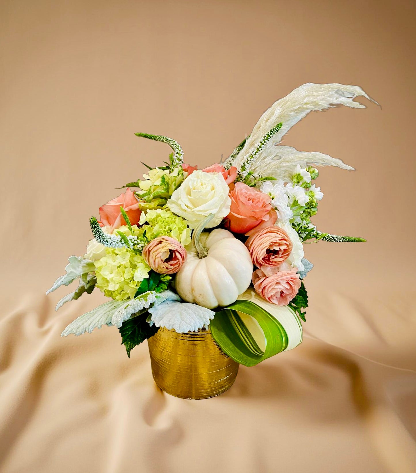 Seasonal Fall flower arrangement with a luxurious touch of pampas grass and white pumpkins