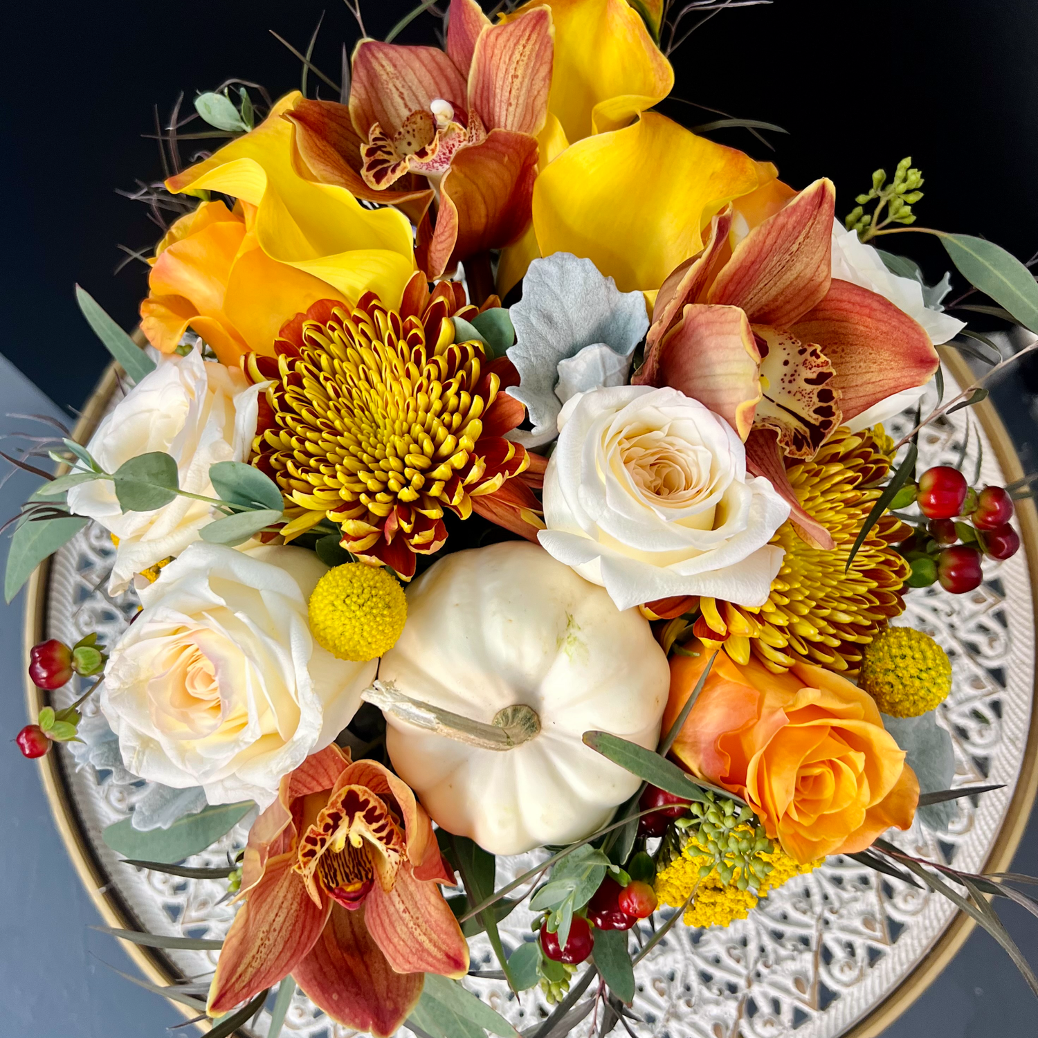 Luxury fall floral centerpiece with real white pumpkin and seasonal tones – Thimbleberry House Las Vegas