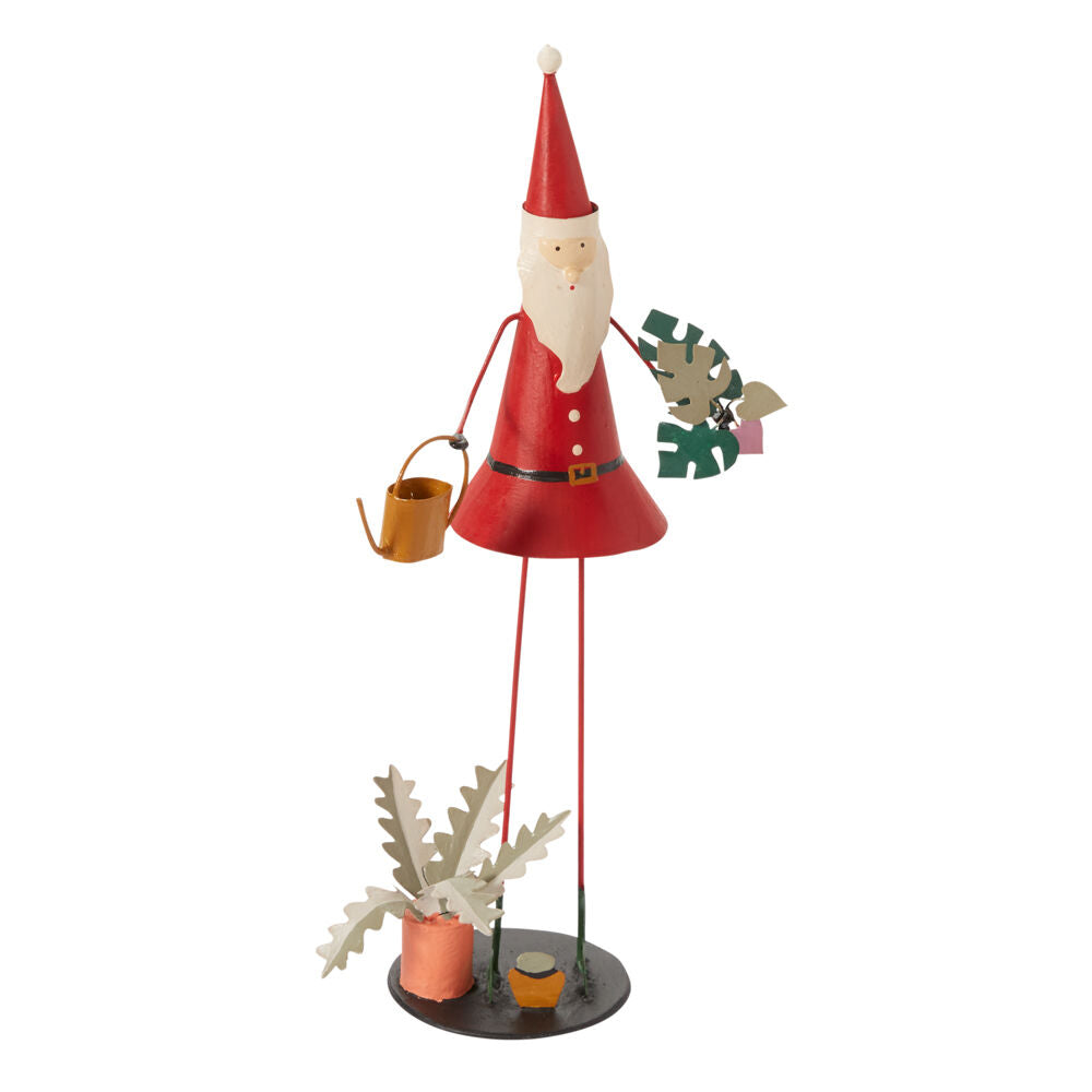 metal santa figurine with watering can and plants on a white background