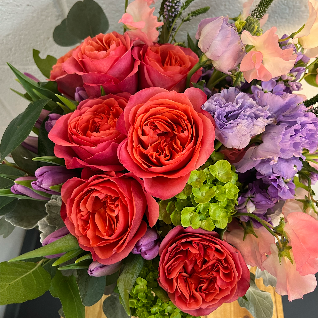 pink roses in a garden style flower arrangement for mother's day