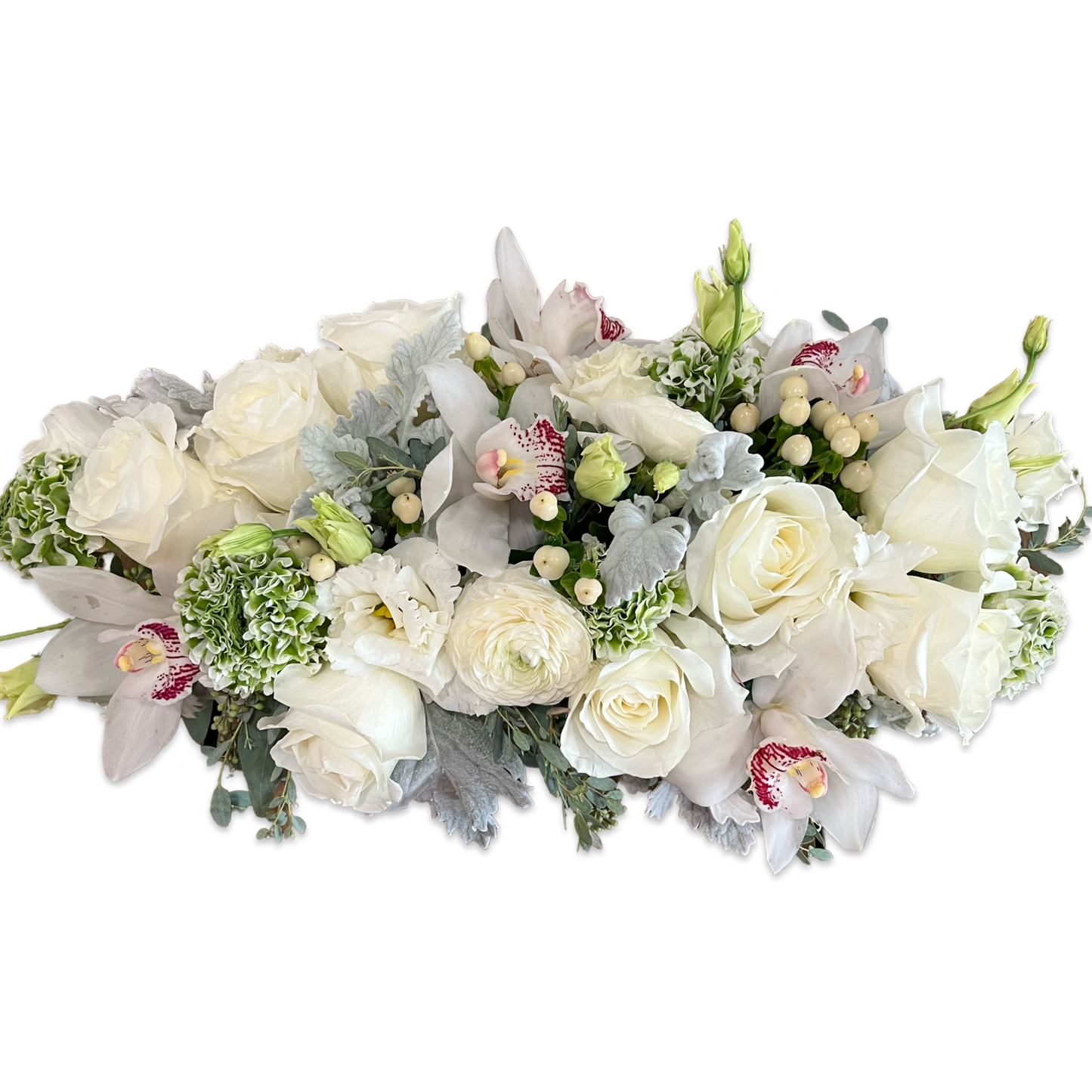 the top of a lush spring centerpiece with with and green flowers
