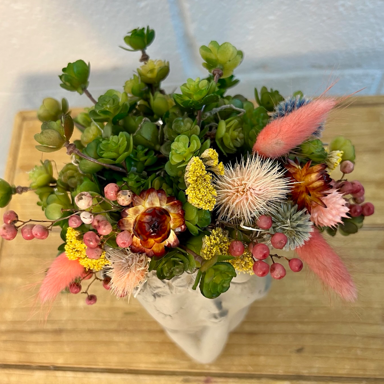 details of the artificial and preserved florals in the whimsical girl head