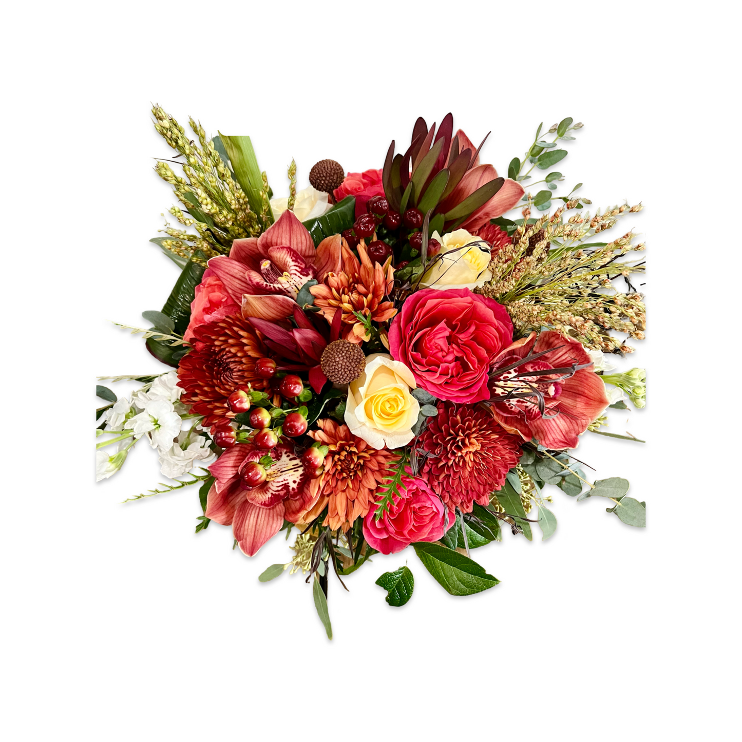 Seasonal fresh flowers in warm fall colors, designed in a lush, textural arrangement