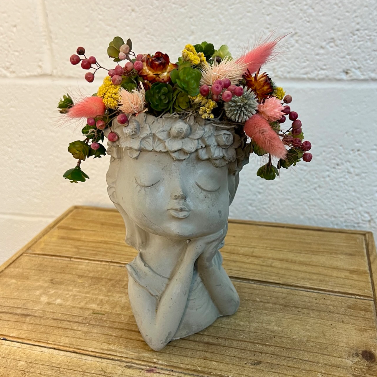 girl head filled with artificial flowers