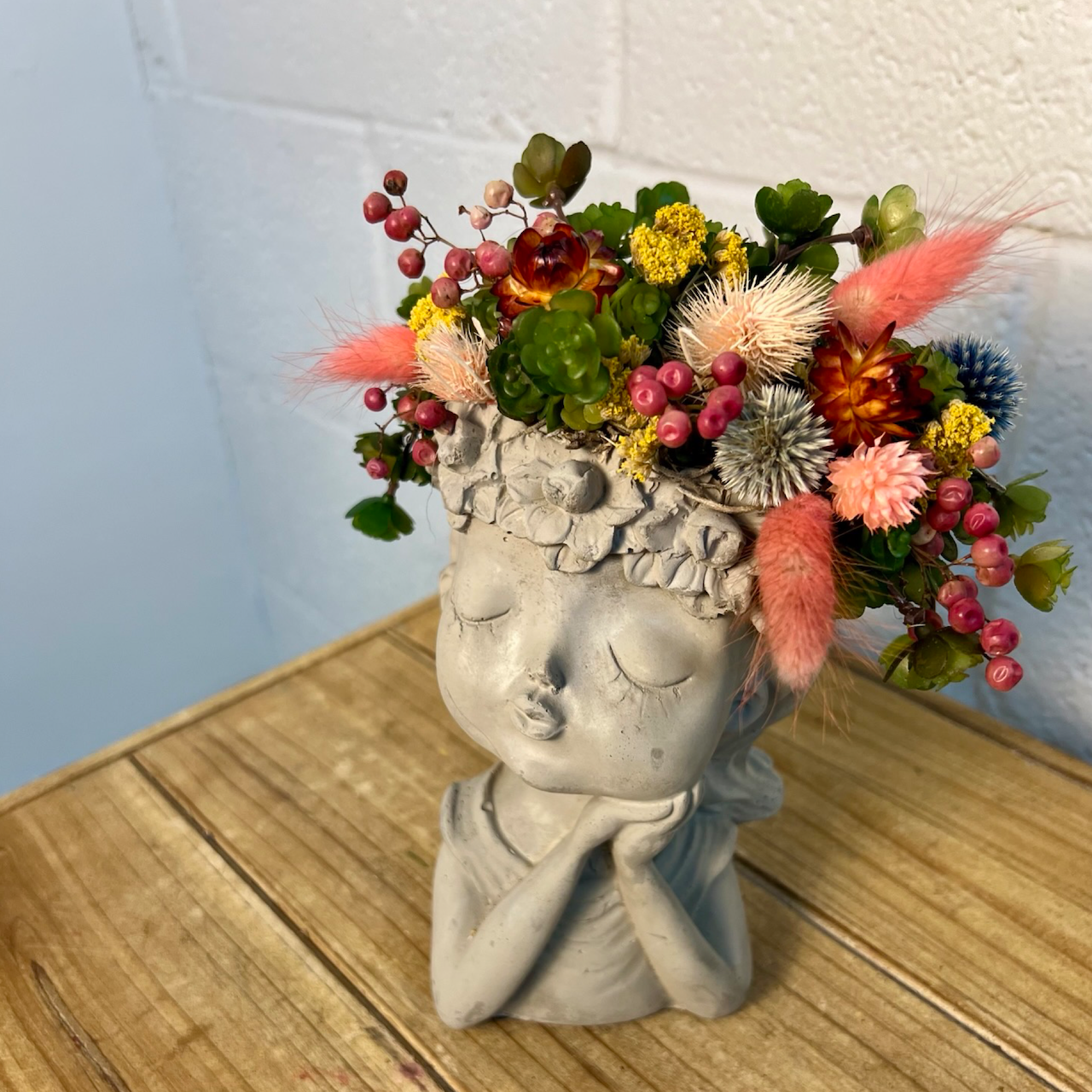 sweet girl pot filled with a mix of artificial, dried and preserved flowers