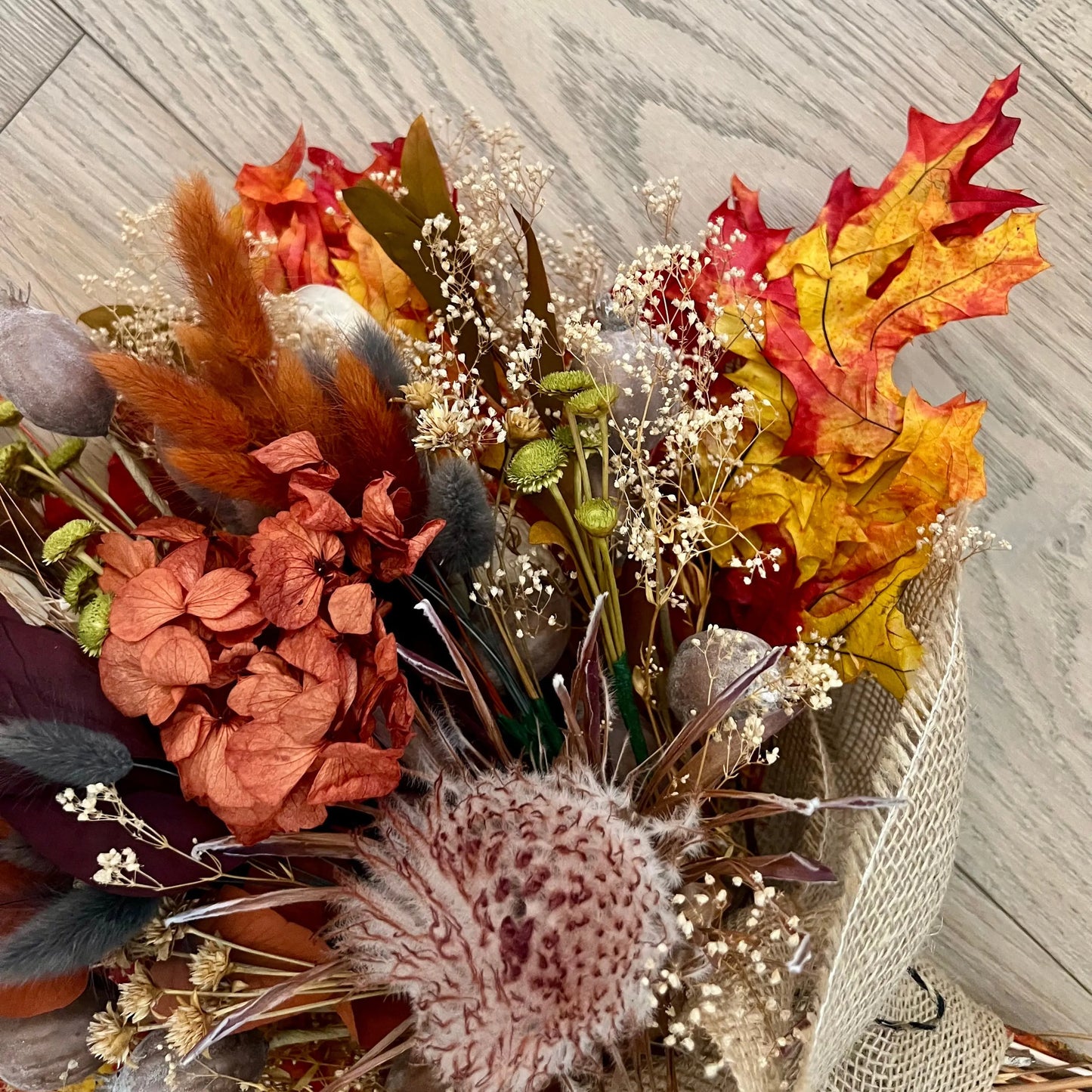 Rustic autumn bouquet with preserved leaves