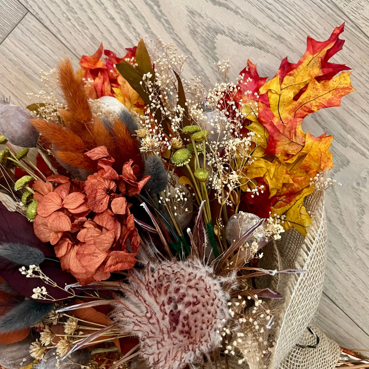 Rustic autumn bouquet with preserved leaves