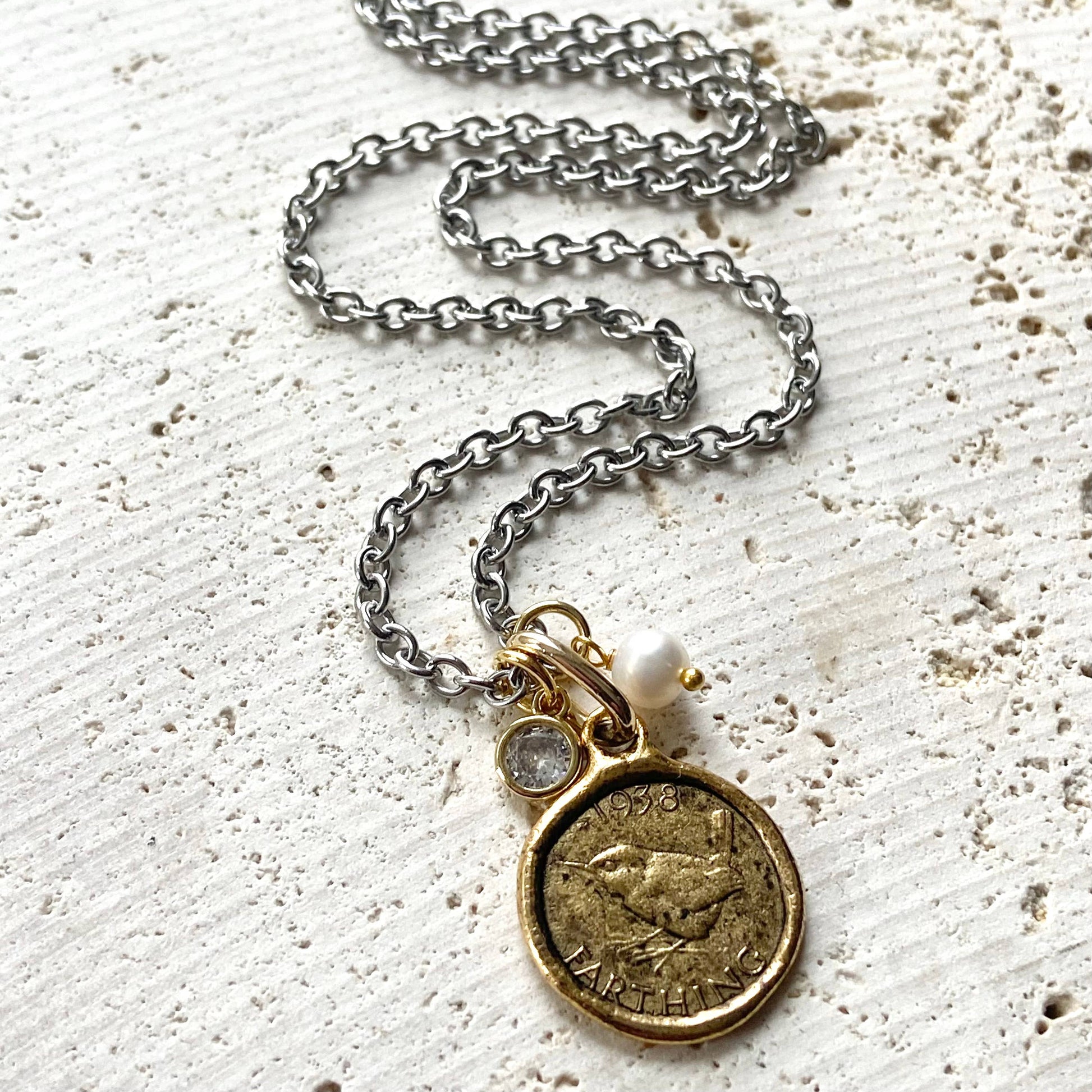 bird coin necklace closeup