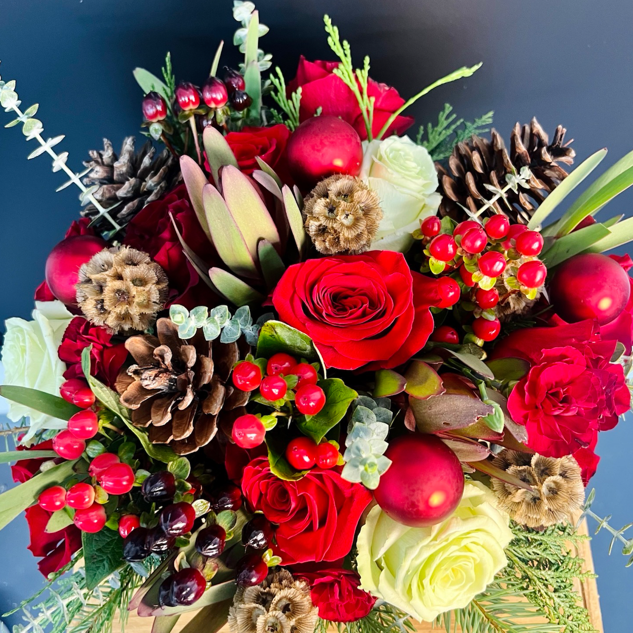 closeup of red round holiday flower centerpiece