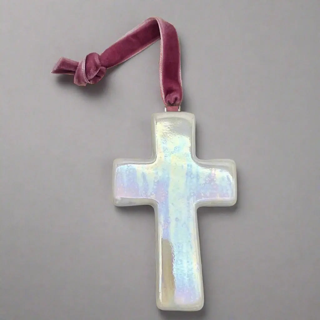 porcelain cross with a mauve velvet ribbon
