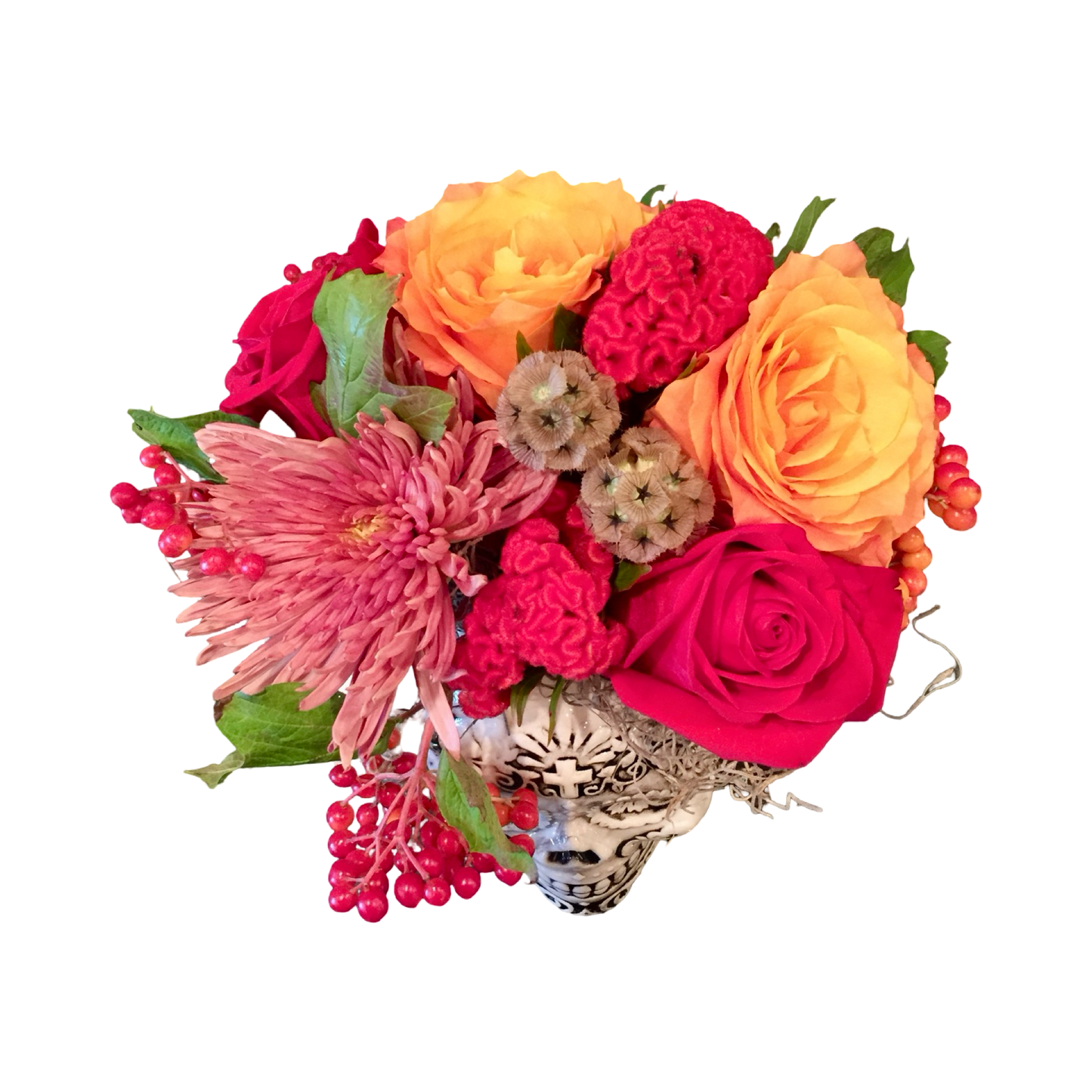Bouquet of red and orange flowers with a decorative skull vase for Las Vegas delivery