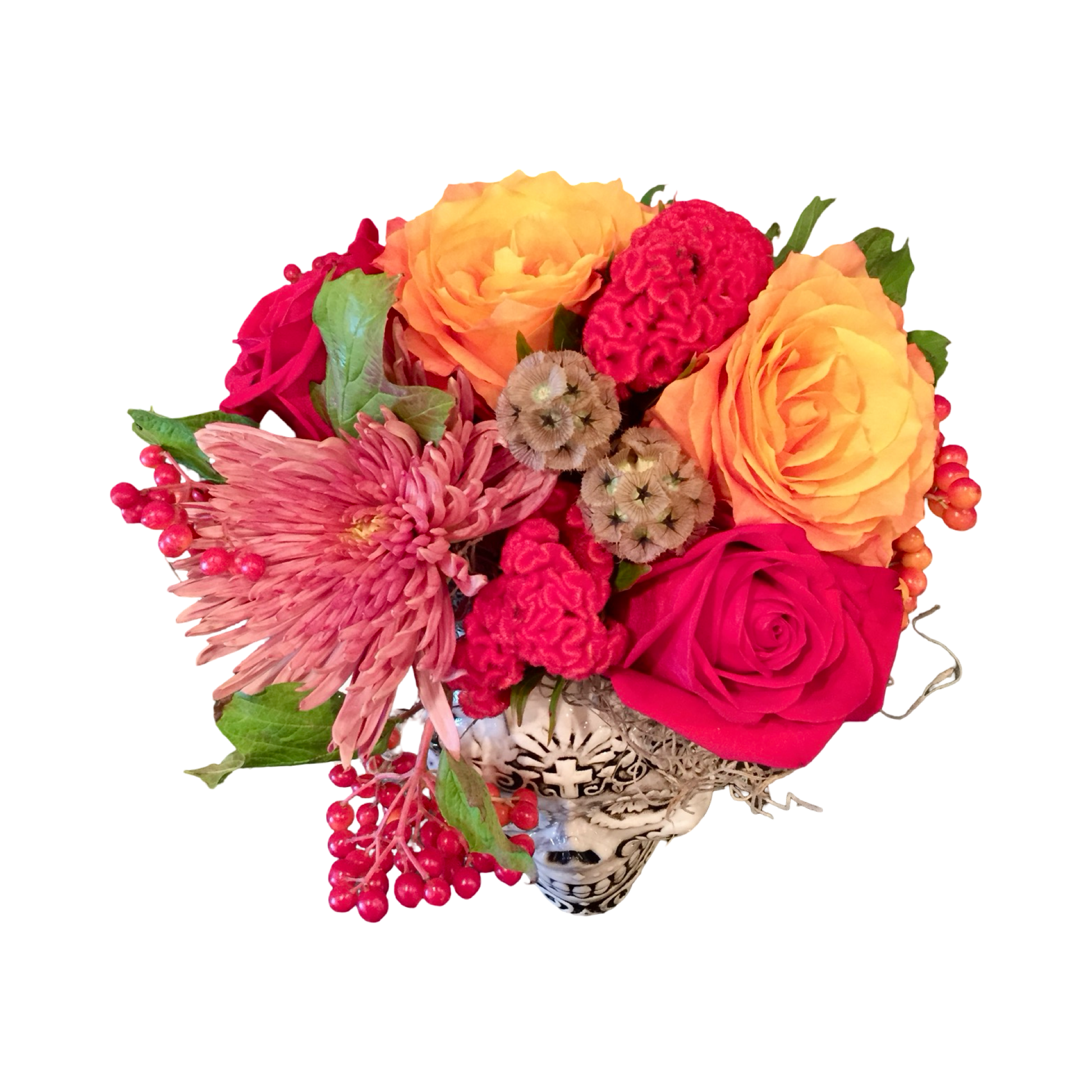 Bouquet of red and orange flowers with a decorative skull vase for Las Vegas delivery