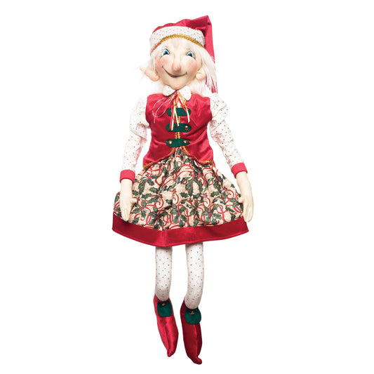 Christmas elf doll by Joe Spencer with red outfit and Santa hat on a white background