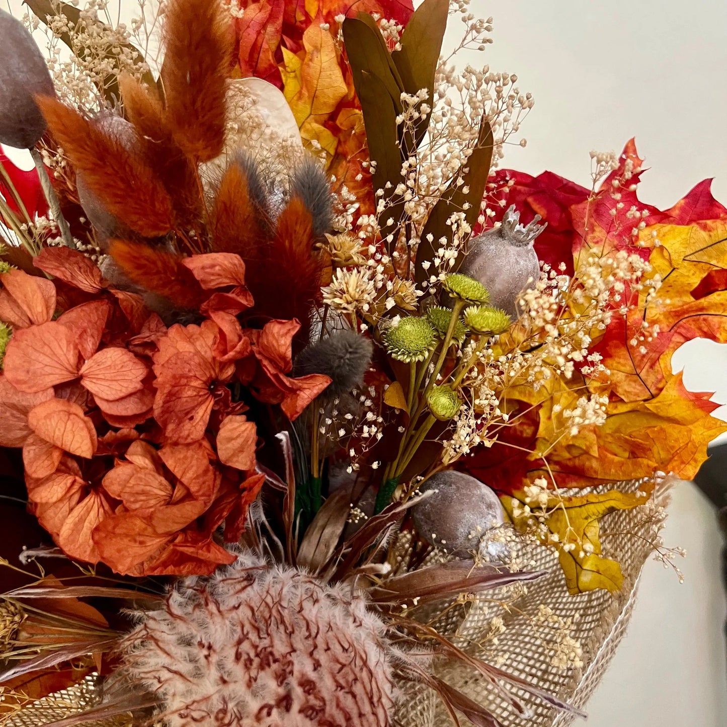 Handcrafted fall bouquet with dried protea