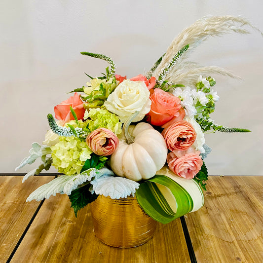 Floral arrangement with pumpkins and pampas grass in an elegant vase. Las Vegas delivery
