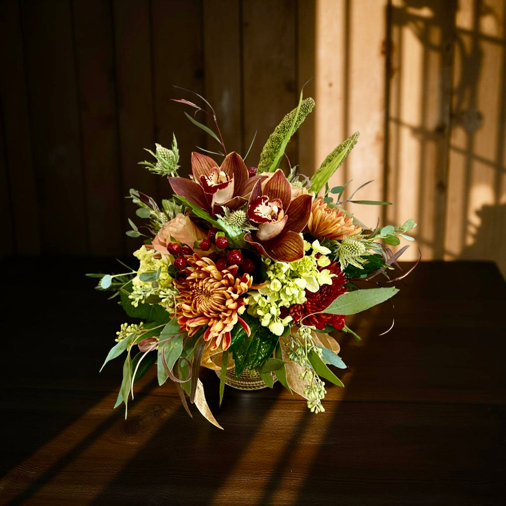 Bouquet of flowers on a wooden surface with a warm glow