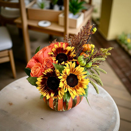 Fall Sunshine fresh flower arrangement with bright sunflowers and roses in a festive designer-chosen vessel