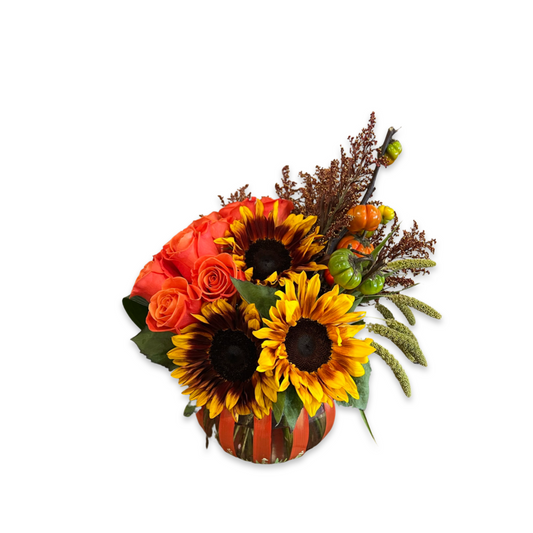 Seasonal autumn bouquet featuring sunflowers, roses, and textural greenery – low and lush design