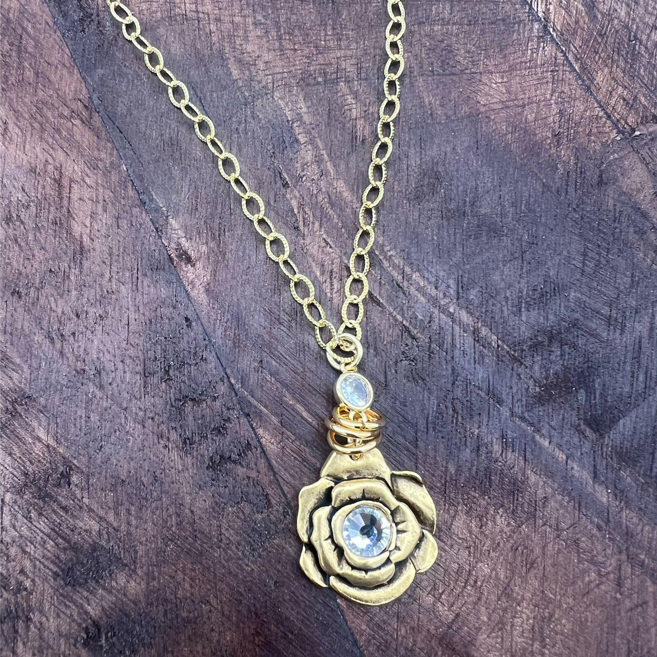 flower pendant necklace with crystal center 