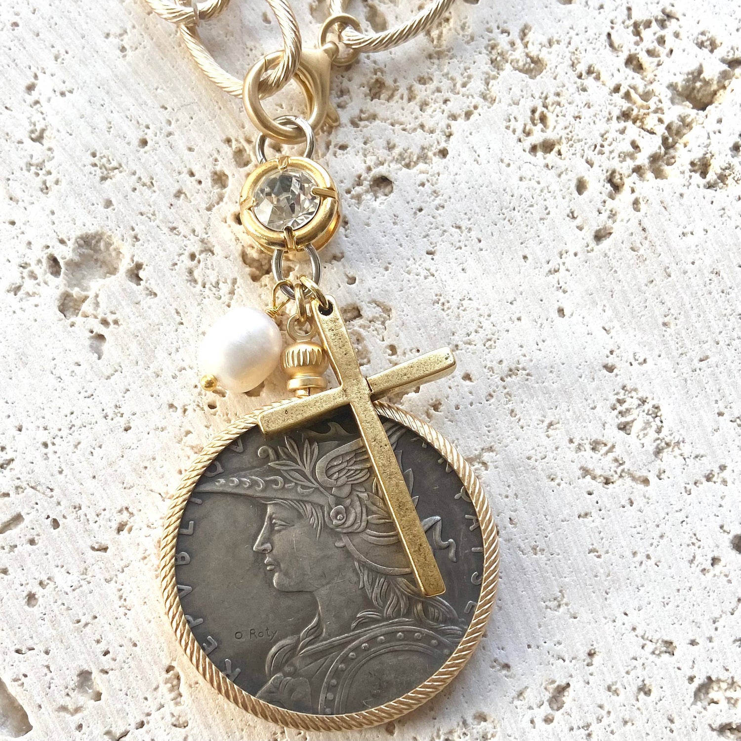 french coin and cross pendant
