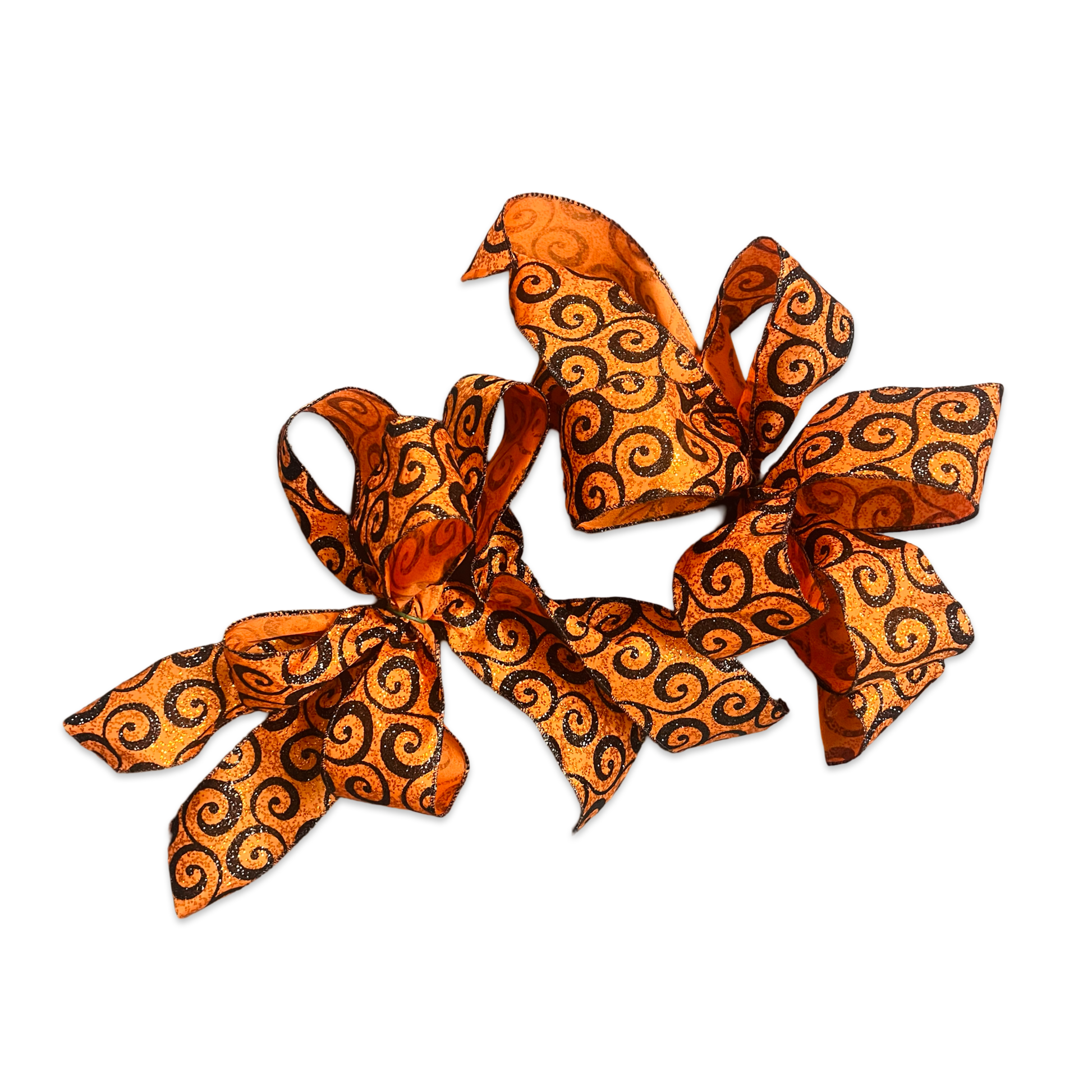 Two orange decorative bows with black patterns on a white background