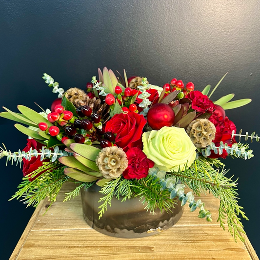 holiday floral centerpiece on a blackground