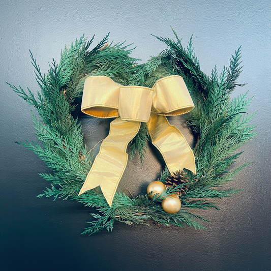 heart wreath with cedar and gold bow