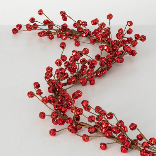 Red decorative jingle bell garland on a white background