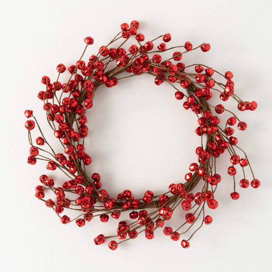 Decorative wreath with red jingle bells on a white background