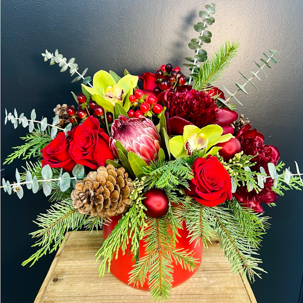 large red holiday flower arrangement