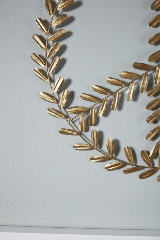 details of peace sign wreath with gold leaves