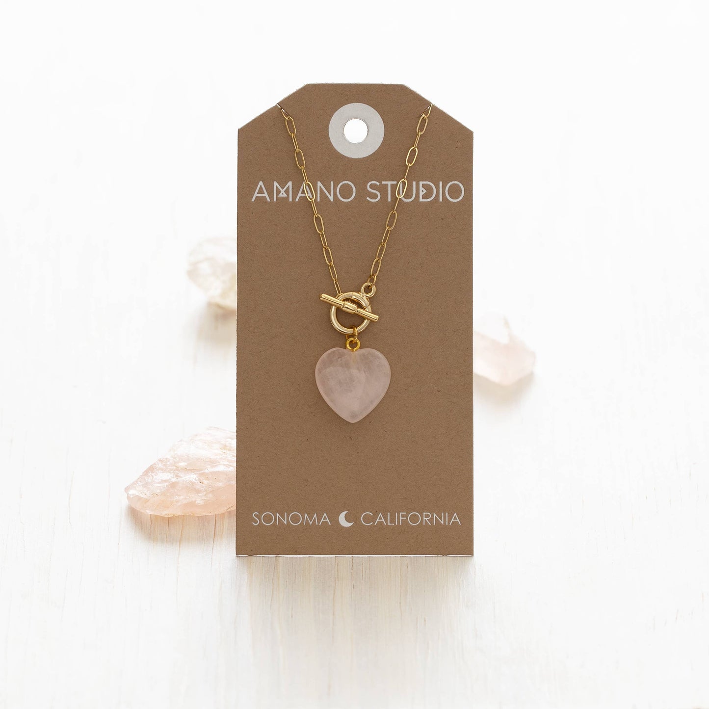 rose quartz heart necklace on gift tag