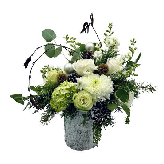 tall white holiday flower arrangement on plain background