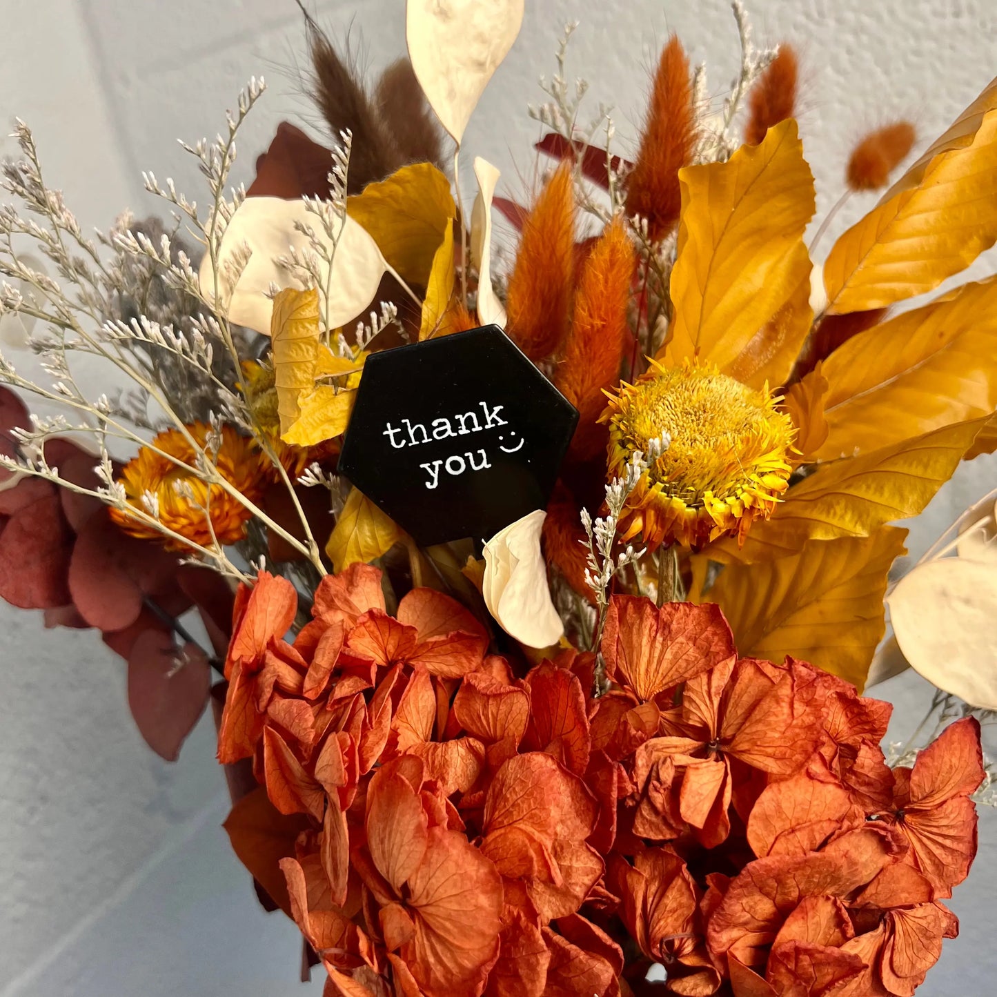 neutral dried flower arrangement with thank you accent
