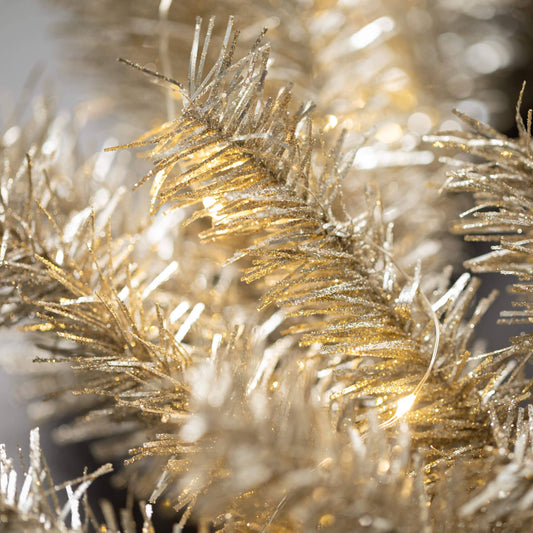 Close-up of gold tinsel with a blurred background