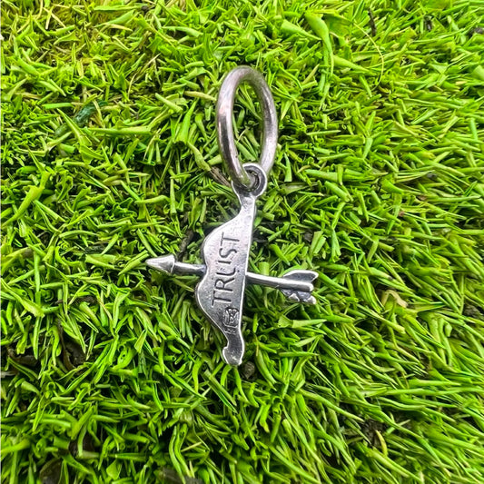 supernaturals arrow charm with "trust" from waxing poetic