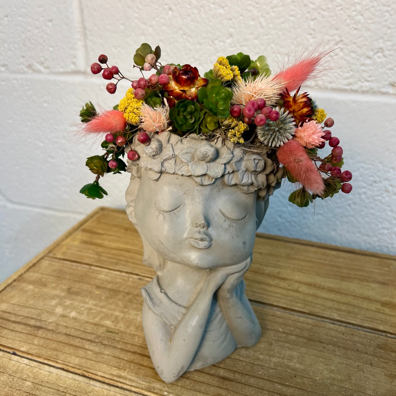 details of the whimsical girl container and flower crown