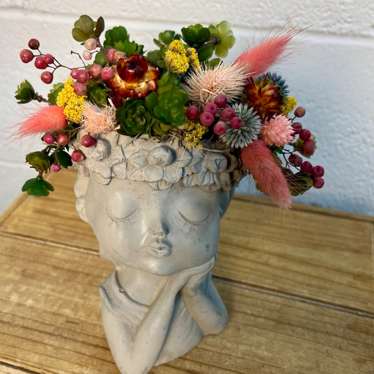 details of dried and preserved flowers in pink, red, yellow and green colors