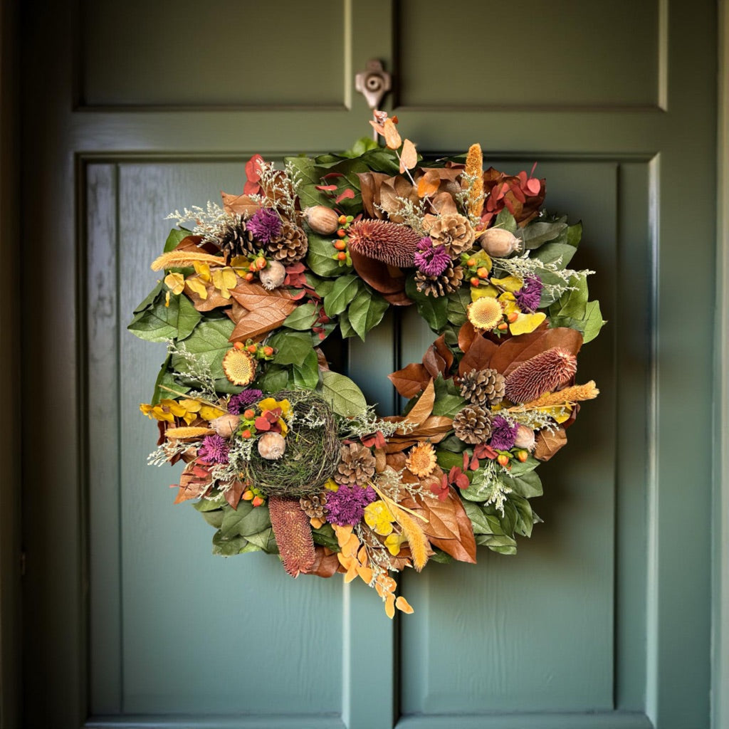Handmade fall wreath with dried eucalyptus and berries
